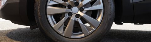 A close up shot a Point S Summer tyre fitted on a gray SUV
