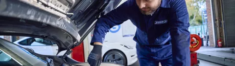 Point S technician checking a car battery's health