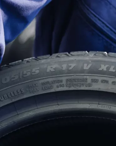 Close-up of a tyre sidewall showing the XL extra load marking next to the 205/55 R17 V size code