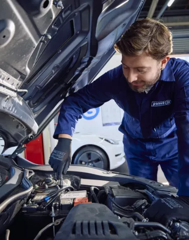 Point S technician checking a car battery's health